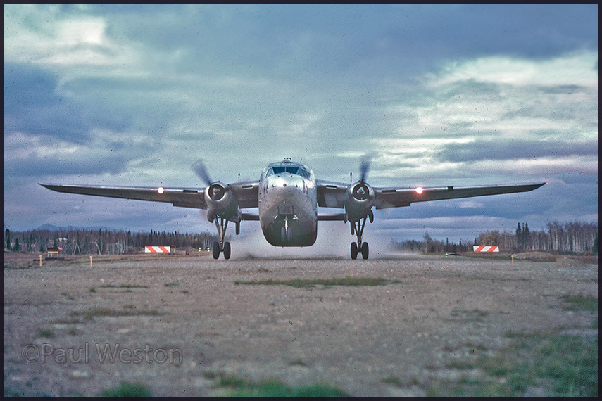 C-119 take off at Ambler,AK. By Paul Weston