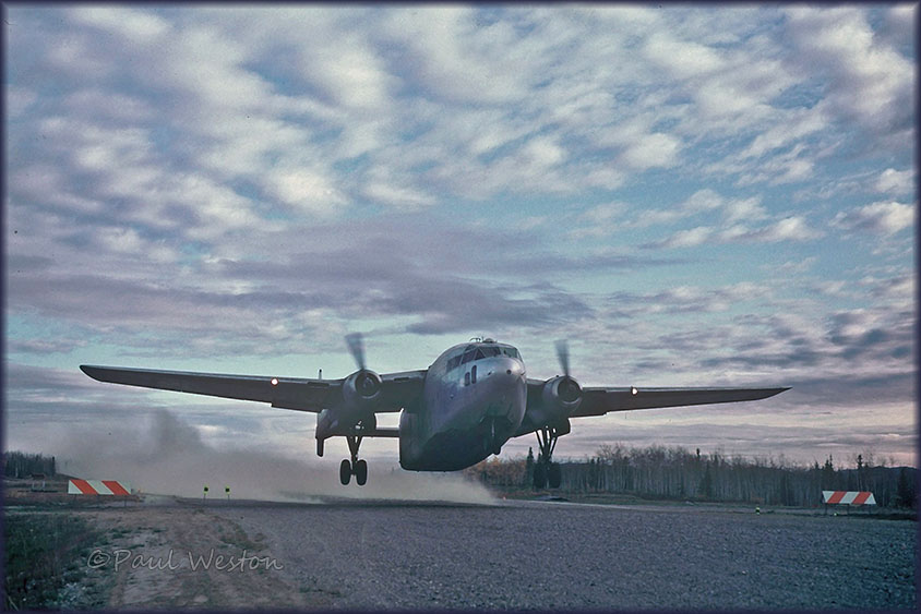 Fairchild C-119 take off from gravel dirtstrip in Alaska